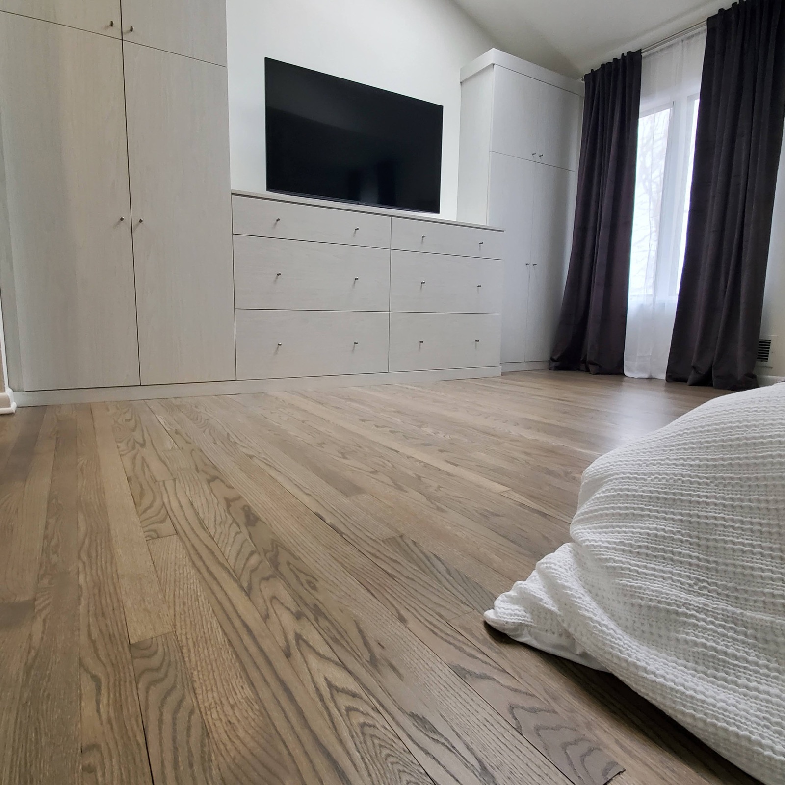 Weathered grey hardwood in a bedroom